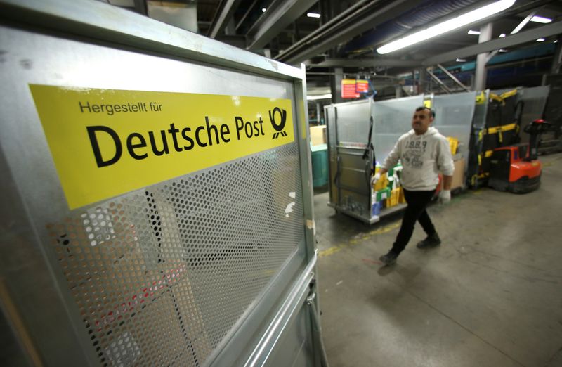 An employee works at a distribution centre of Deutsche Post DHL in Rodgau