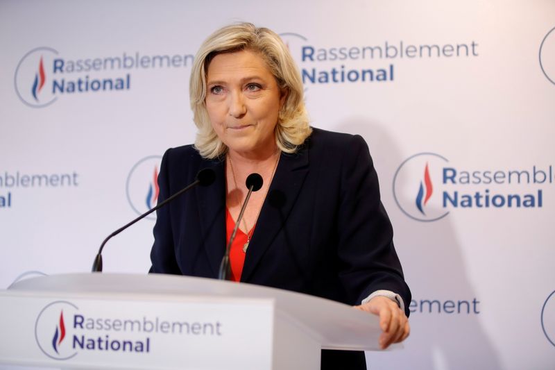 FILE PHOTO: French far right leader Marine Le Pen reacts to the results of regional election, in Nanterre