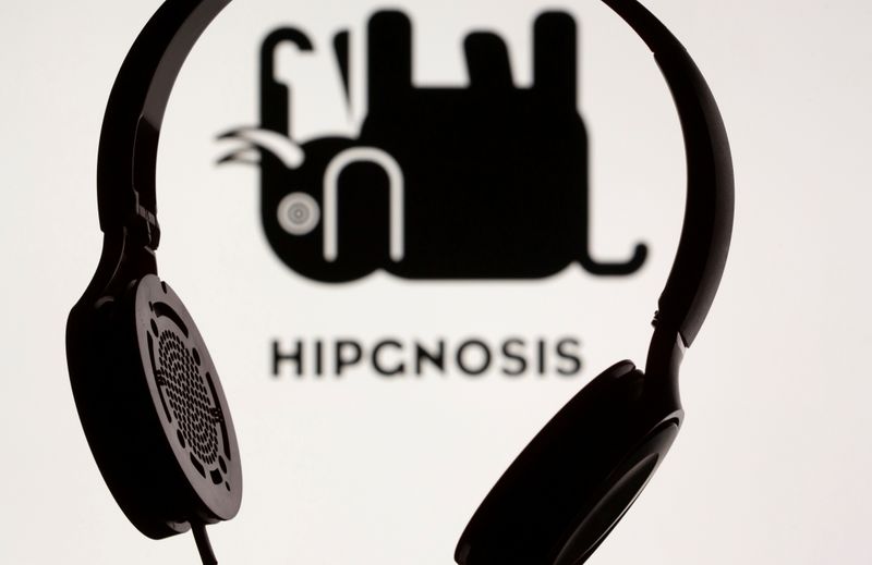 FILE PHOTO: Headset seen in front of displayed Hipgnosis logo in this illustration