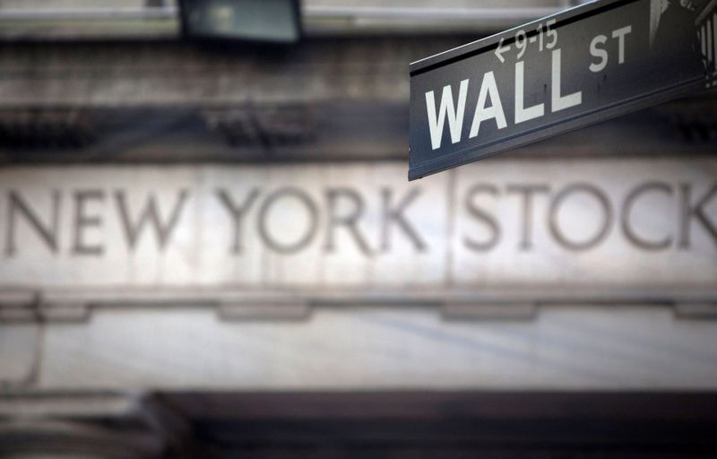 FILE PHOTO: A Wall Street sign outside the New York Stock Exchange