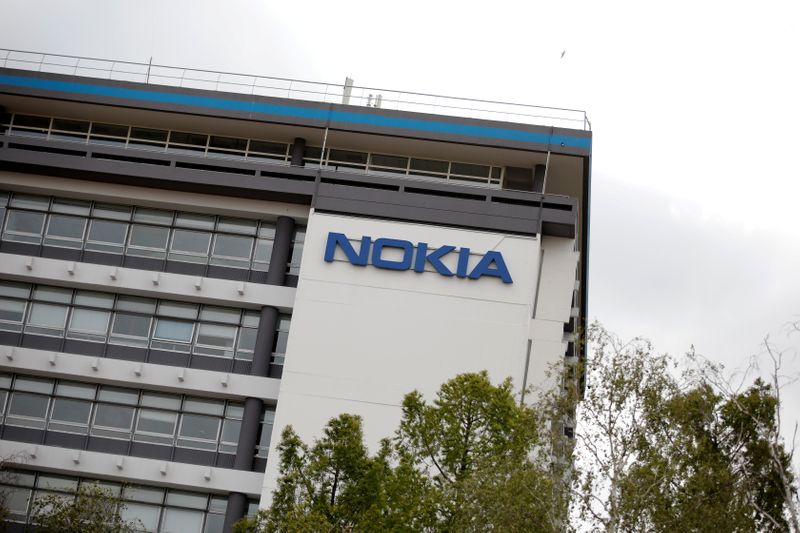 FILE PHOTO: Workers protest over job cuts at Nokia in France