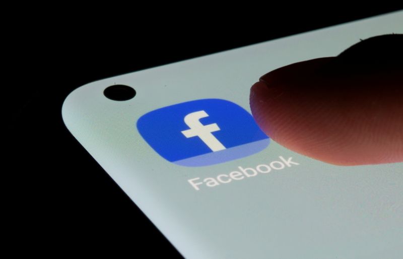 FILE PHOTO: Facebook app is seen on a smartphone in this illustration