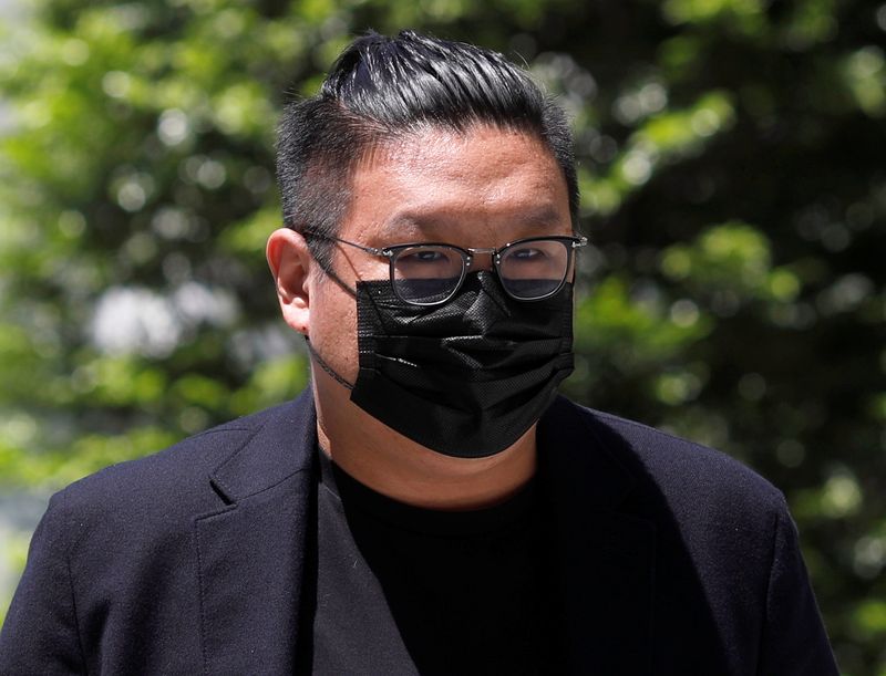 FILE PHOTO: Ng Yu Zhi, a director of Envy Global Trading, arrives at the State Court in Singapore