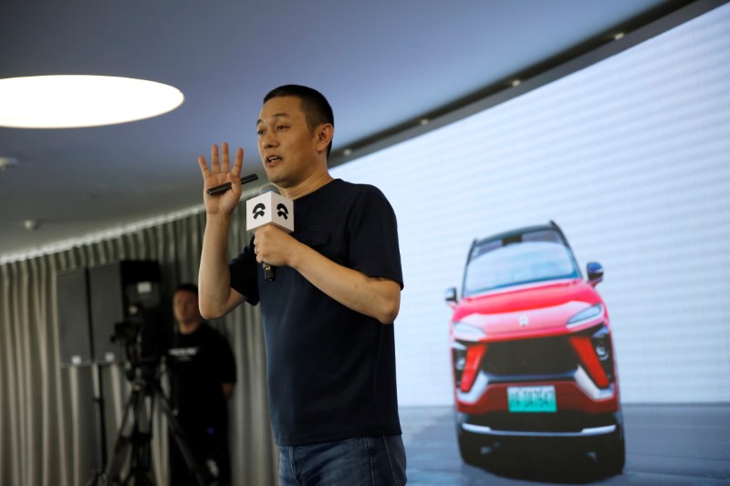 William Li, founder and chief executive officer (CEO) of the electric vehicle maker NIO Inc, speaks at a launch event on battery leasing service in Beijing