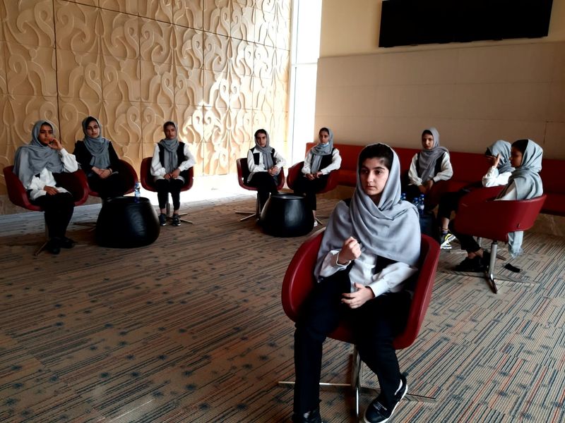 Ayda Haydarpour, a member of an Afghan all-girls robotics team who were evacuated last week from Afghanistan, talks during an interview with Reuters in Doha