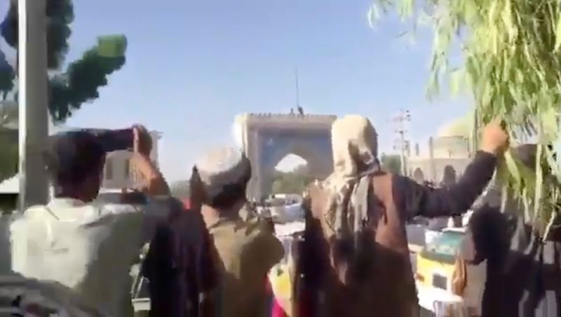 People gather near Kandahar city gate in the Eid Gah Darwaza area
