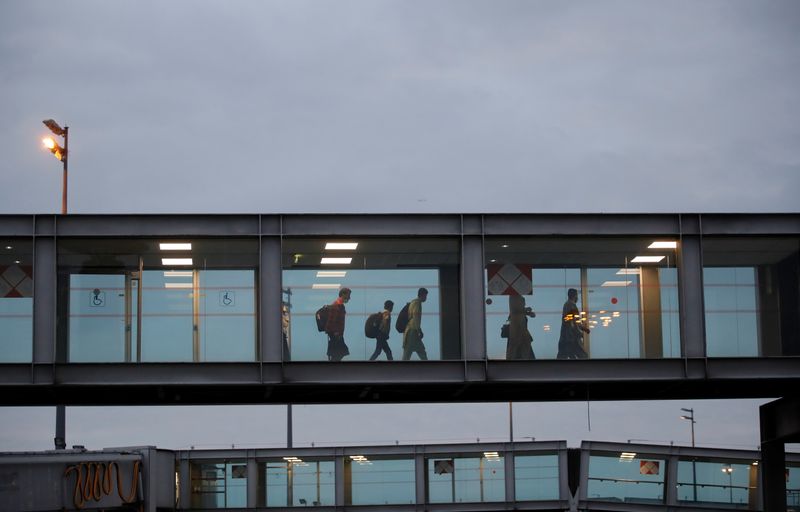 People evacuated from Afghanistan arrive at Roissy Charles-de-Gaulle airport, near Paris