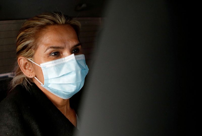 FILE PHOTO: Bolivia's former interim President Jeanine Anez is seen in a car outside the FELCC (Special Force to fight against Crime) headquarters in La Paz