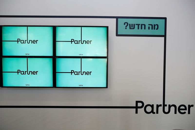 FILE PHOTO: Screens displaying the logo of Partner, an Israeli communication firm, are seen at the headquarters in Rosh Ha'ayin near Tel Aviv, Israel