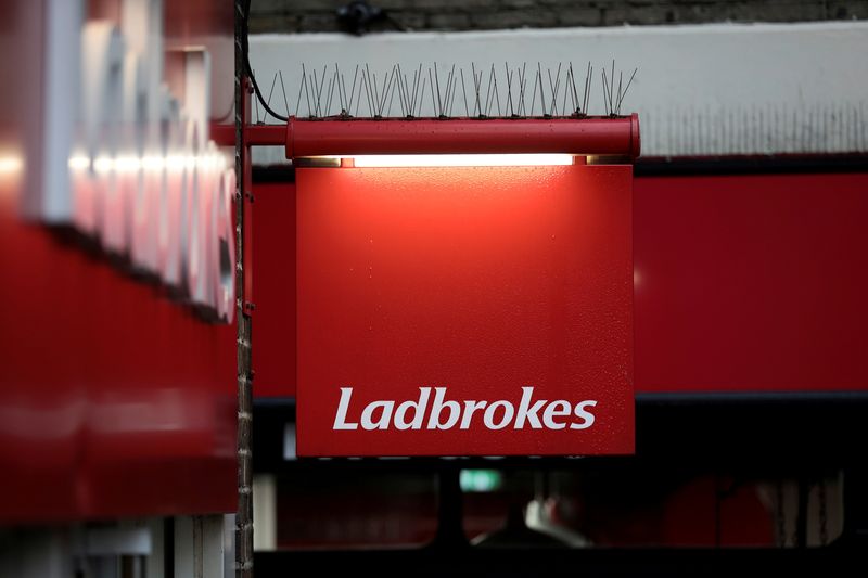 FILE PHOTO: A sign hangs outside a branch of Ladbrokes in London