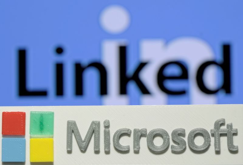 FILE PHOTO: A 3D printed logo of Microsoft is seen in front of a displayed LinkedIn logo in this illustration