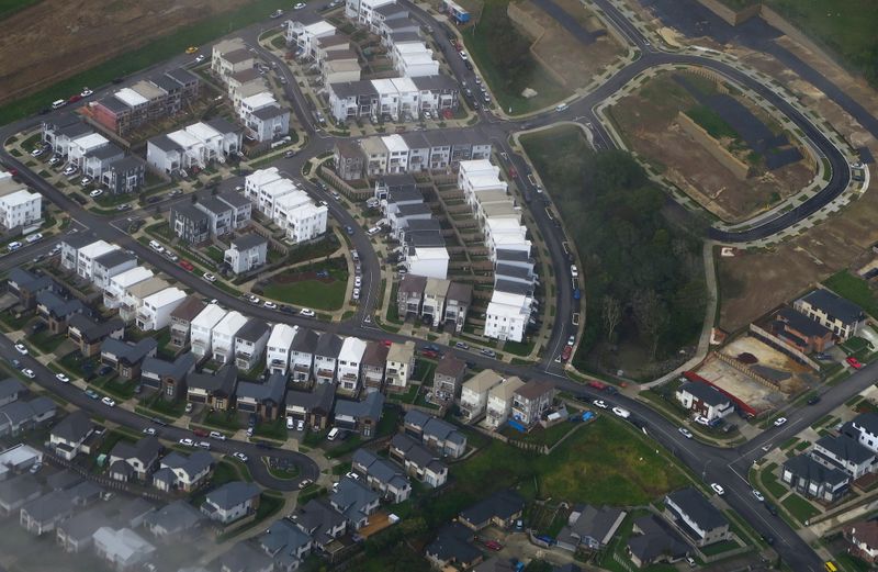 A newly built housing estate can be seen next to another under construction in a suburb of Auckland in New Zealand