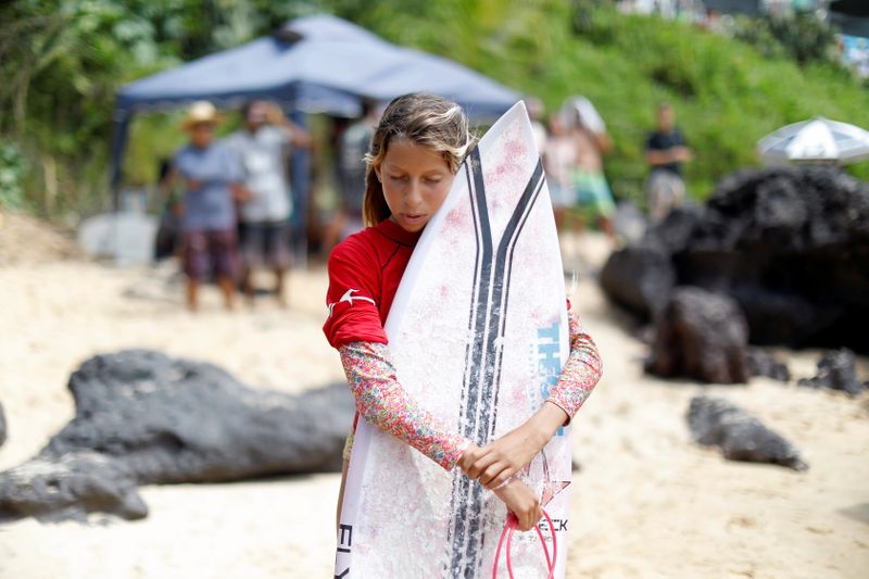 Inspired by Brazil's gold medalist Italo Ferreira, 12-year-old Maria Clara, surfs the waves and dreams of an Olympic career