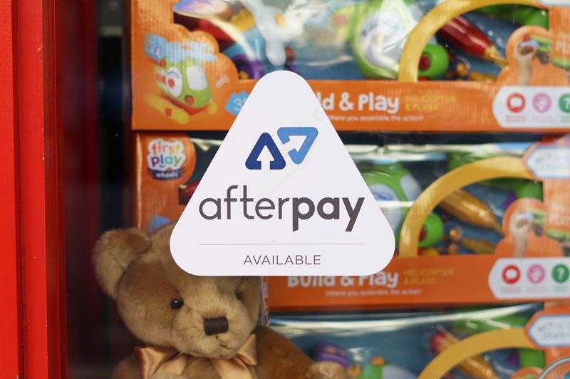 FILE PHOTO: A logo for the company Afterpay is seen in a store window in Sydney
