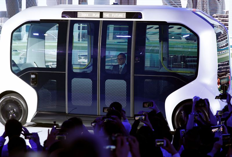 Toyota Motor Corporation President Akio Toyoda, arrives in their e-Palette autonomous concept vehicle to give his presentation at the Tokyo Motor Show, in Tokyo