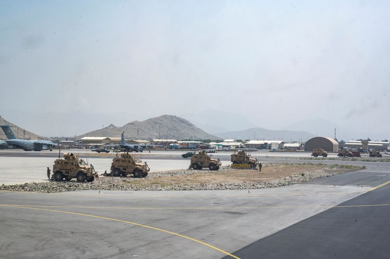 FILE PHOTO: U.S. Army soldiers assigned to the 82nd Airborne Division patrol Hamid Karzai International Airport in Kabul
