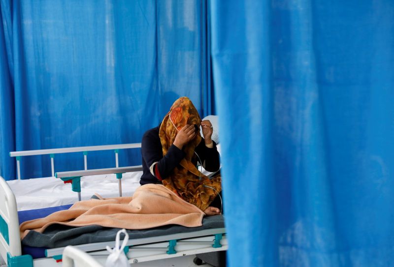 FILE PHOTO: A patient suffering from COVID-19 receives treatment at the Afghan-Japan Hospital in Kabul