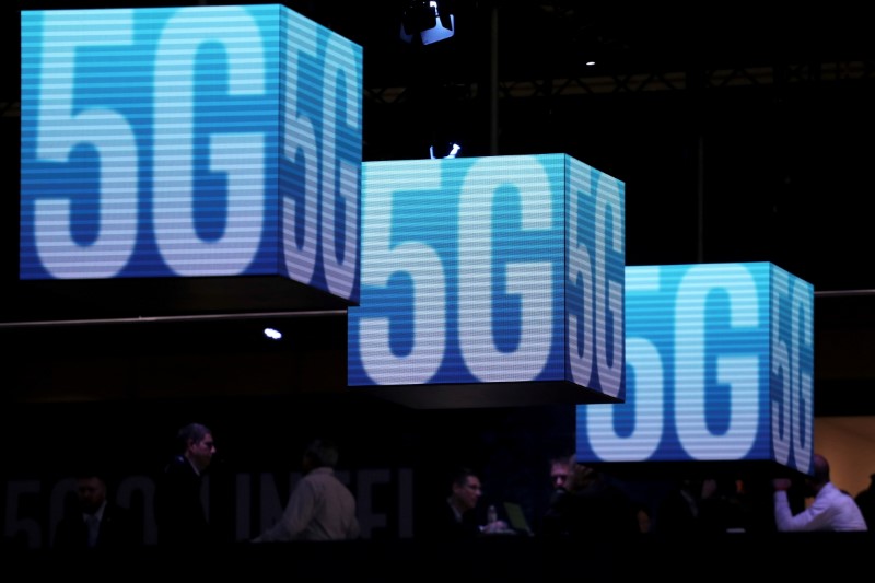 FILE PHOTO: Hanging cubes display 5G logo at the Mobile World Congress in Barcelona