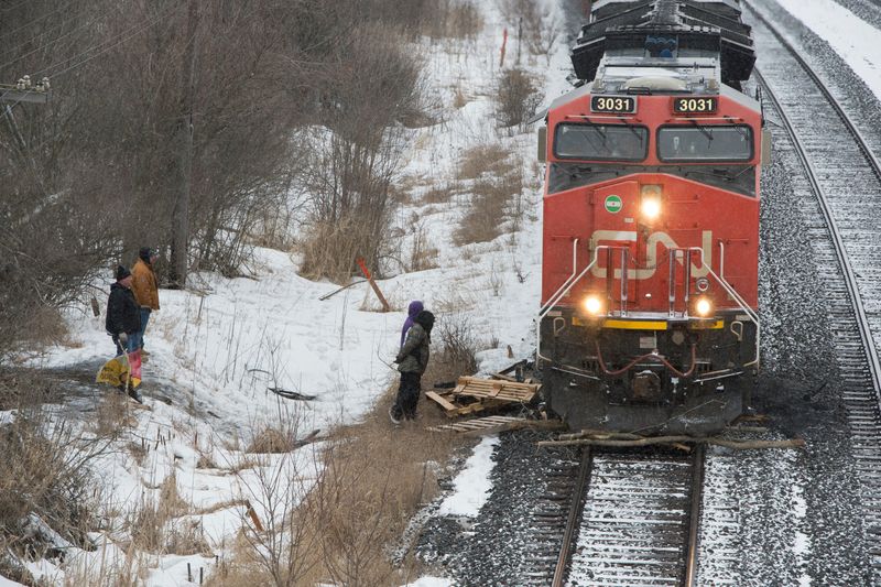 FILE PHOTO: A Canadian National Railway (CN Rail) train moves through wooden pallets beside an encampment of the Tyendinaga Mohawk Territory