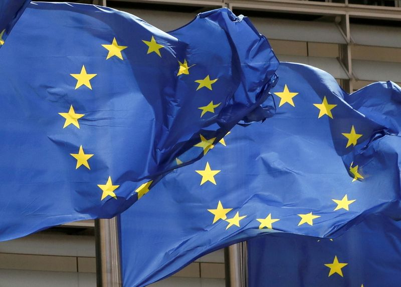 FILE PHOTO: European Union flags flutter outside the EU Commission headquarters in Brussels