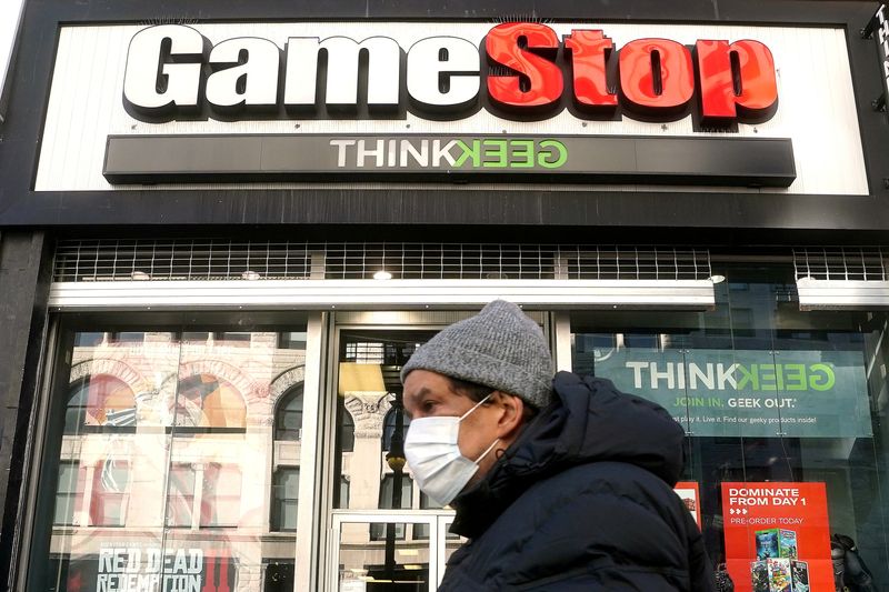 FILE PHOTO: A person walks past a GameStop in New York