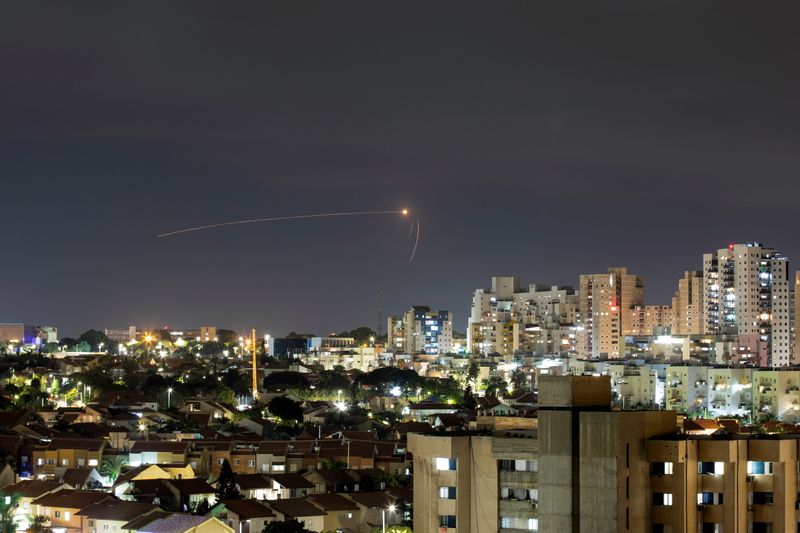Streaks of light are seen as Israel's Iron Dome anti-missile system intercepts a rocket launched from the Gaza Strip towards Israel, as seen from Ashkelon