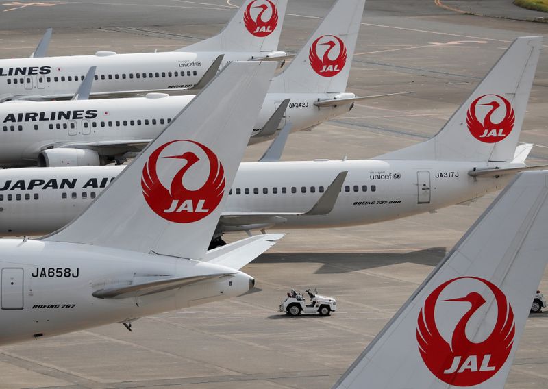 FILE PHOTO: Japan Airlines' (JAL) airplanes are seen, amid the coronavirus disease (COVID-19) outbreak, at Haneda Airport in Tokyo