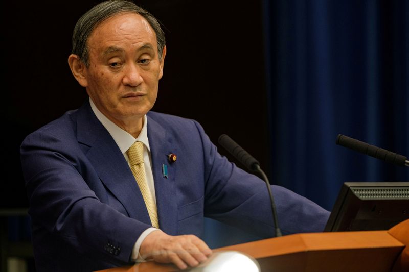 FILE PHOTO: Japan's PM Yoshihide Suga speaks during a news conference at the prime minister's official residence