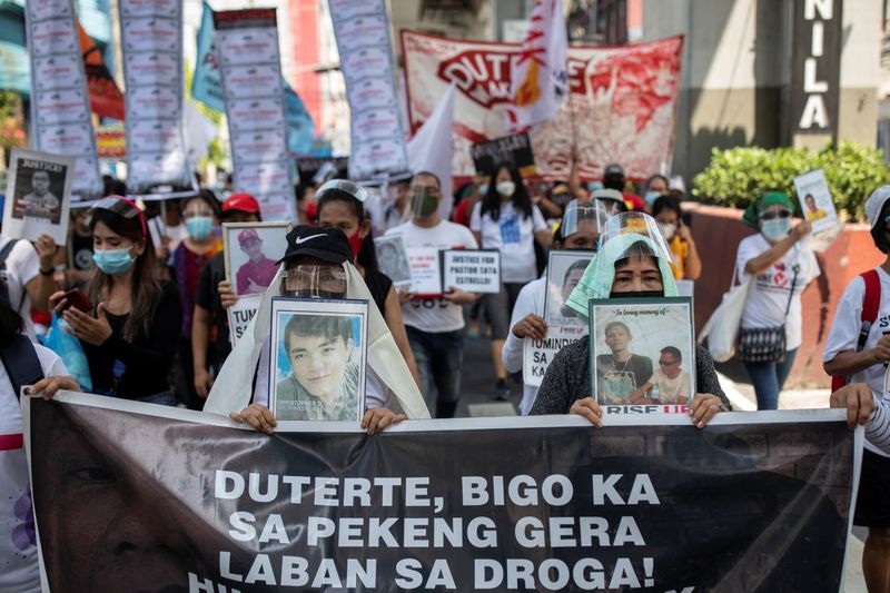 FILE PHOTO: Filipinos hold protest to commemorate Duterte's final year as president