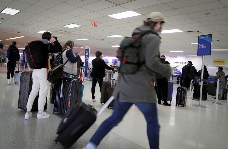 FILE PHOTO: Travelers at Newark International Airport ahead of Thanksgiving holiday in Newark, New Jersey