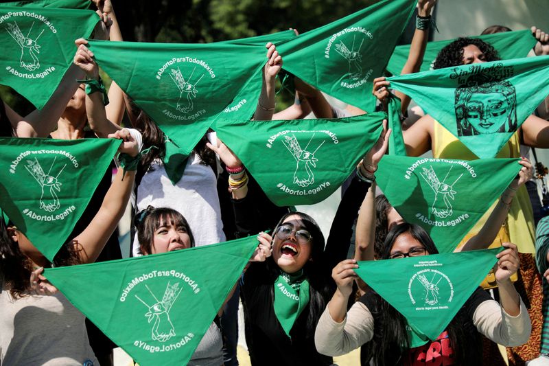 FILE PHOTO: Women hold green handkerchiefs during a protest in support of legal and safe abortion in Mexico City