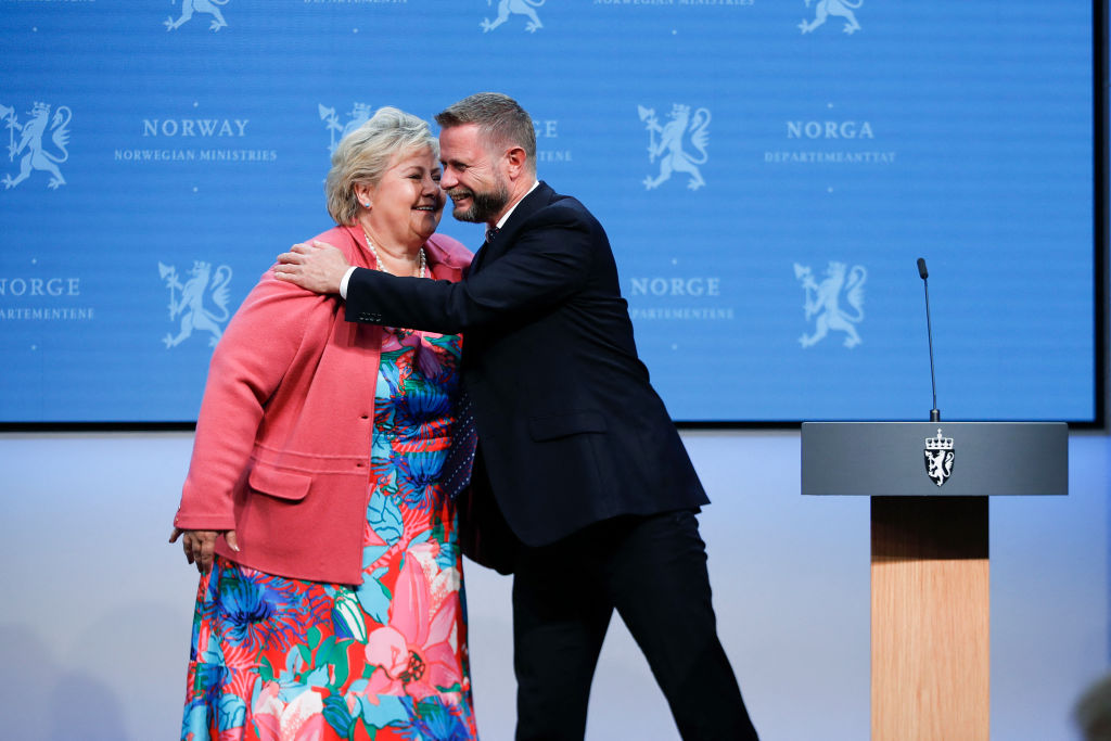 Norway's Prime Minister Erna Solberg is hugged by Norway's Minister of Health Bent Hoie during a press conference on the corona Covid-19 situation in Oslo, on September 24, 2021. - Norway OUT (Photo by Javad Parsa / NTB / AFP) / Norway OUT (Photo by JAVAD PARSA/NTB/AFP via Getty Images)