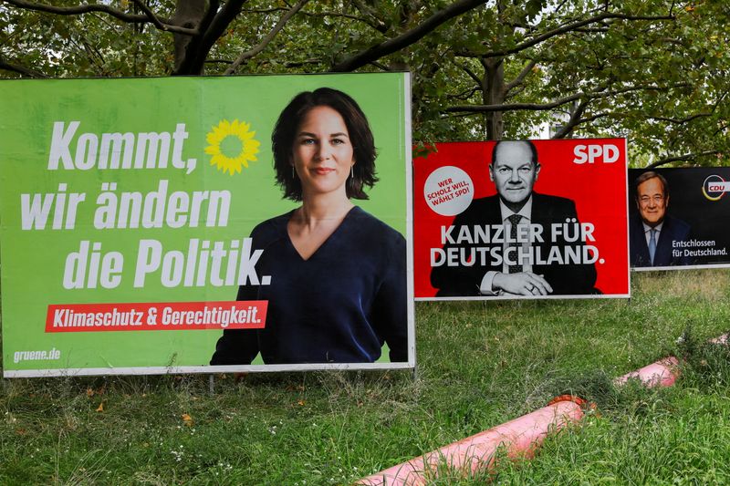 FILE PHOTO: Top candidates for the German Chancellery feature on election campaign billboards