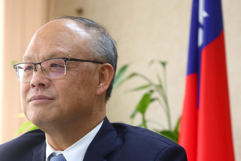 FILE PHOTO: Taiwan's Chief trade negotiator John Deng looks on as he speaks to the media in Taipei