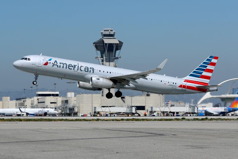 FILE PHOTO: FILE PHOTO: An American Airlines Airbus A321 plane takes off from Los Angeles International airport