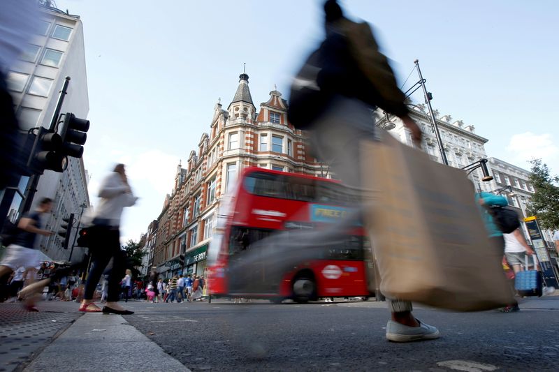 FILE PHOTO: Shoppers crossing the road in Oxford Street, in London