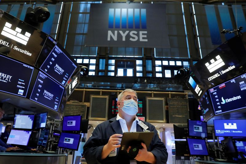 A trader works on the floor at the New York Stock Exchange (NYSE) in Manhattan, New York City