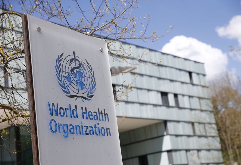 A logo is pictured outside a building of the WHO in Geneva