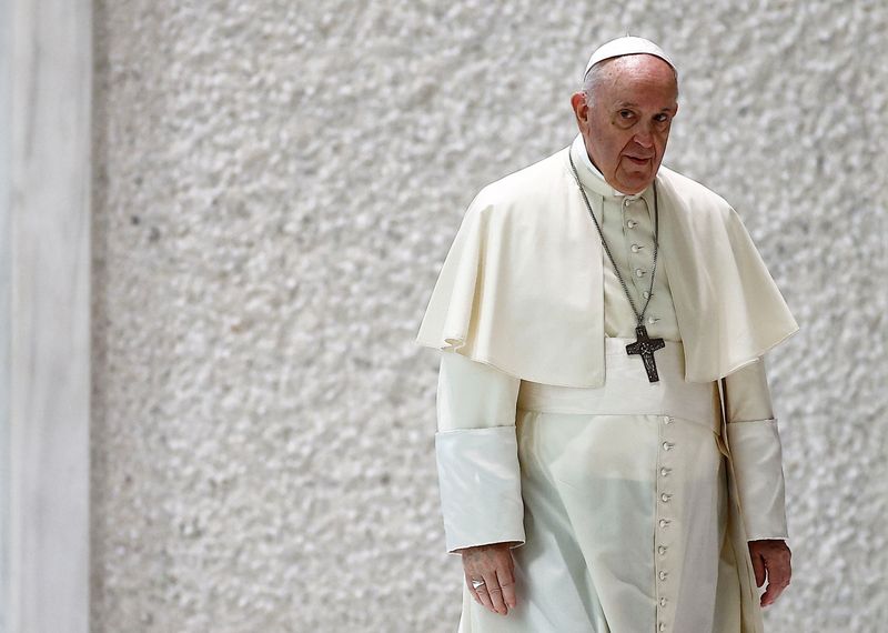 FILE PHOTO: Pope Francis arrives at the Paul VI Audience Hall at the Vatican