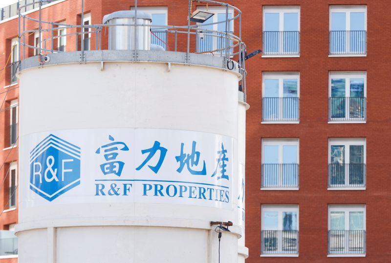 FILE PHOTO: The logo of developer R&F Properties is seen near its One Thames City construction site at Nine Elms, in London