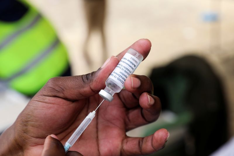 FILE PHOTO: Health worker draws a dose of the AstraZeneca/Oxford COVID-19 vaccine, in Nairobi
