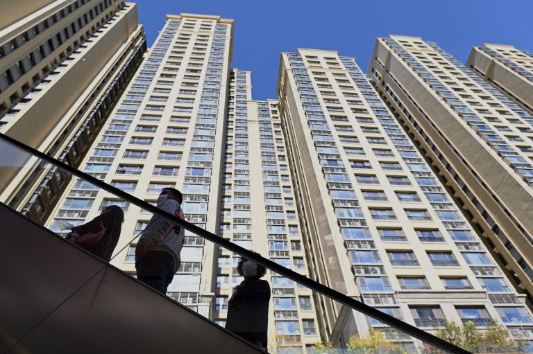 China Evergrande set to avert default as property developer reportedly pays off bond interest