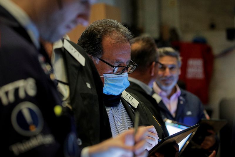 Traders work on the floor of the NYSE in New York