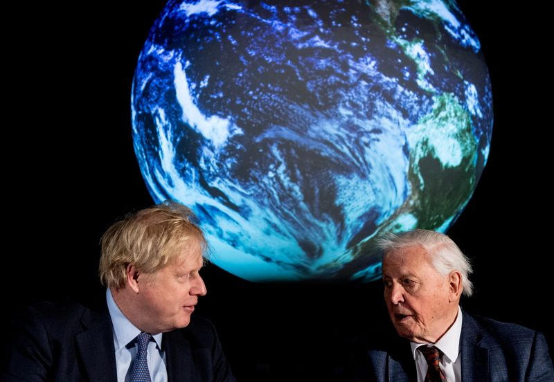 FILE PHOTO: British Prime Minister Boris Johnson and David Attenborough attend a conference about COP26 UN Climate Summit, in London