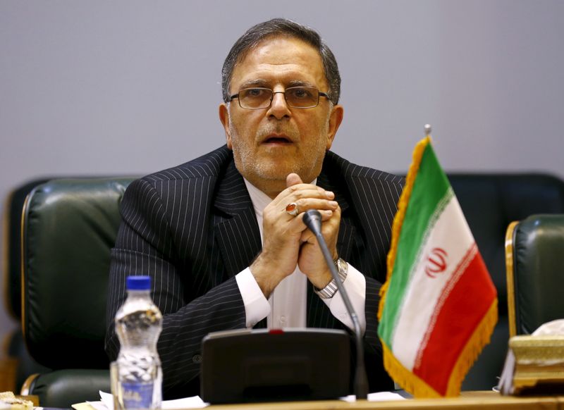 Valiollah Seif, Governor of Central Bank of Iran, waits to start a meeting with Britain's Foreign Secretary Philip Hammond in Tehran