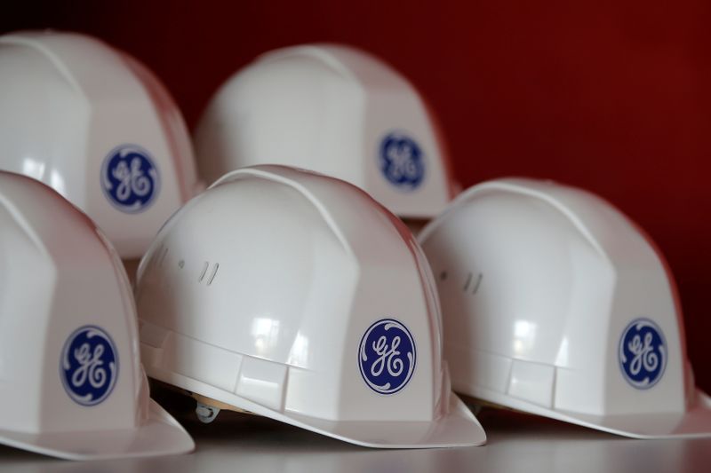 FILE PHOTO: The General Electric logo is pictured on working helmets during a visit at the General Electric offshore wind turbine plant in Montoir-de-Bretagne