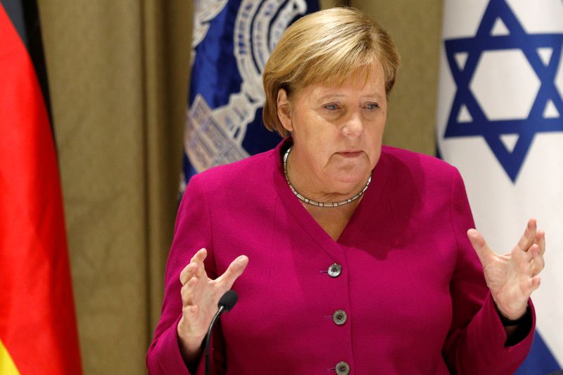 German Chancellor Angela Merkel gestures as she delivers remarks following her meeting with Israeli President Reuven Rivlin in Jerusalem