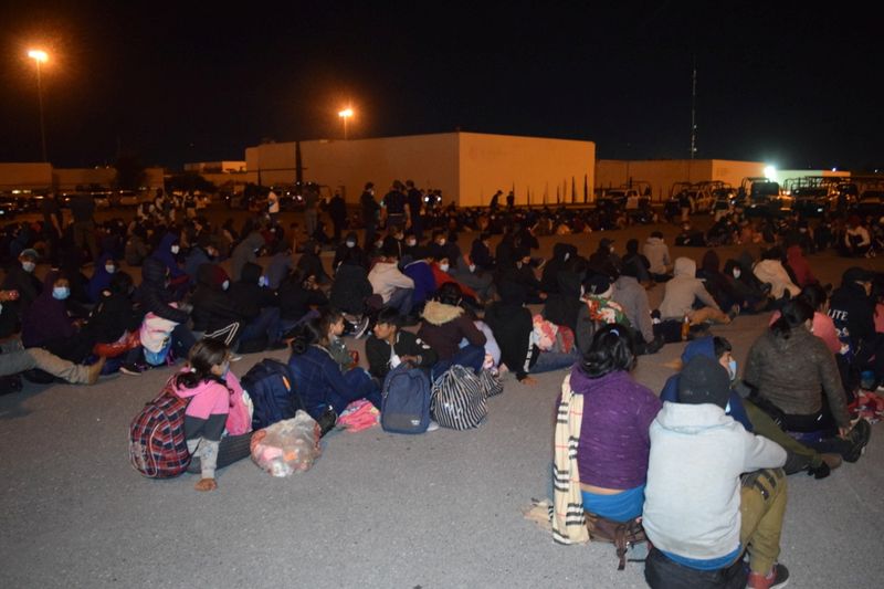 Migrants sit in a complex field of Public Security in Ciudad Victoria