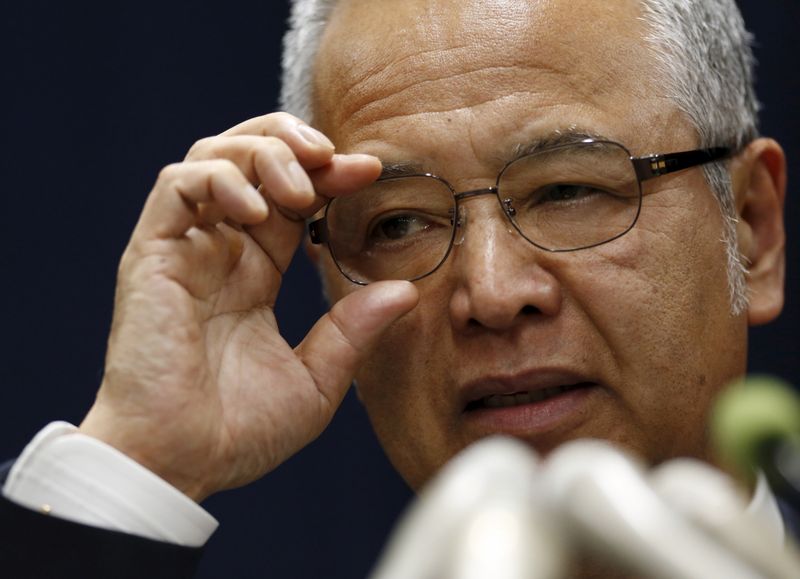 FILE PHOTO: Japan's Economics Minister Amari speaks during a news conference in Tokyo