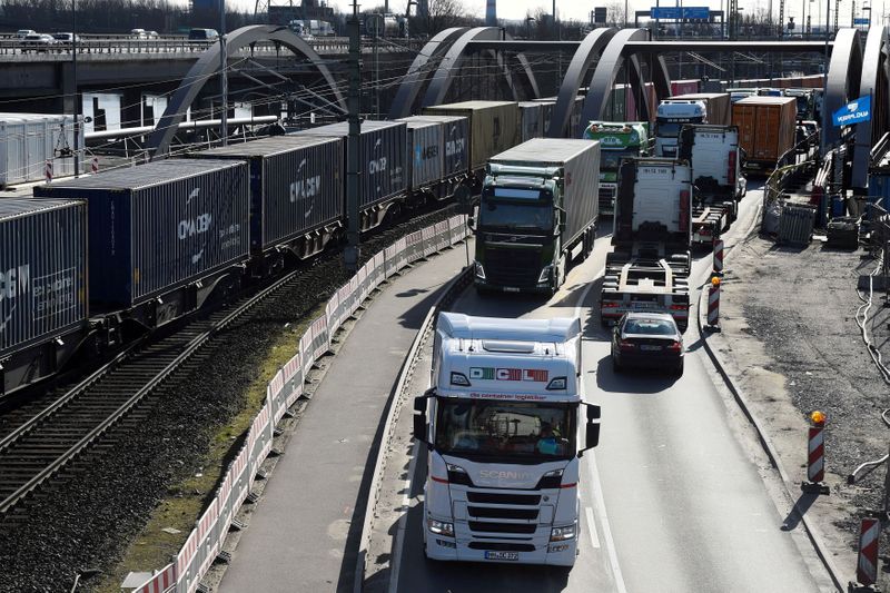 FILE PHOTO: Containers are transported to loading terminals in the port in Hamburg